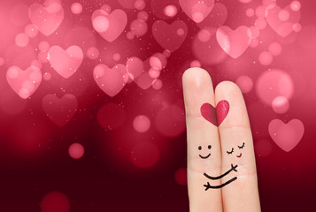 Two fingers while smiling face with nature hearts background. Happy couple in love