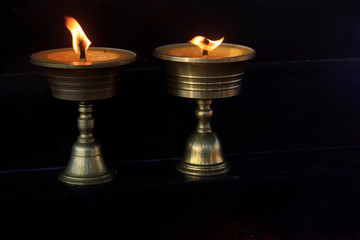 butter lamp in black background