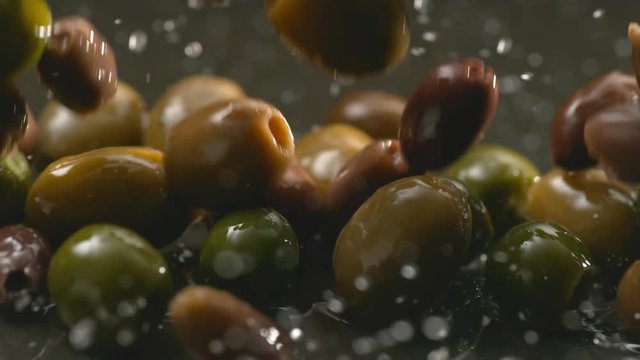 Olives and olive oil in slow motion