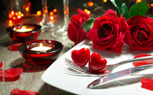 Festive table place setting for Valentines day dinner
