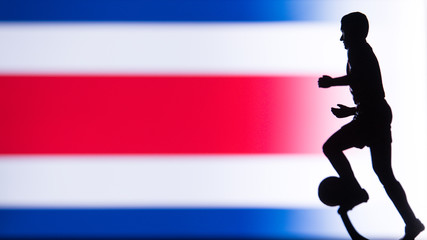 Fototapeta na wymiar Costa Rica National Flag. Football, Soccer player Silhouette