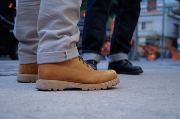 wearing yellow boot on the street