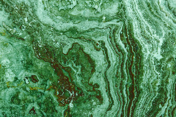 the texture of artificial marble green emerald color with a beautiful pattern similar to the mineral malachite.