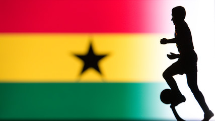 Fototapeta na wymiar Ghana National Flag. Football, Soccer player Silhouette