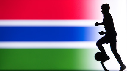 Fototapeta na wymiar Gambia National Flag. Football, Soccer player Silhouette