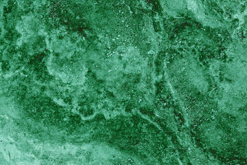 the texture of artificial marble green emerald color with a beautiful pattern similar to the mineral malachite.