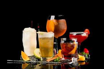 cold drinks with fruit on black background