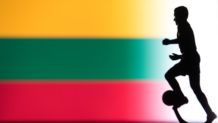 Fototapeta na wymiar Lithuania National Flag. Football, Soccer player Silhouette