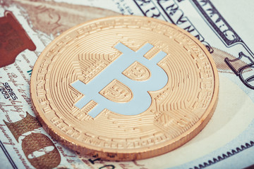 Fototapeta na wymiar Hundred USA dollars with bitcoin over it