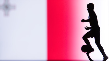 Fototapeta na wymiar Malta National Flag. Football, Soccer player Silhouette