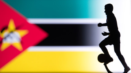 Fototapeta na wymiar Mozambique National Flag. Football, Soccer player Silhouette