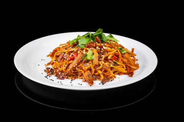 noodles with meat on a black background