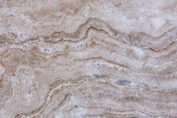 Obraz na płótnie Canvas the texture of artificial marble is light natural beige with a beautiful pattern and dark inclusions.