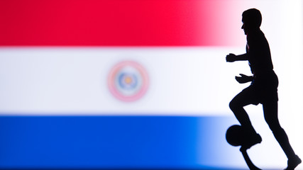 Fototapeta na wymiar Paraguay National Flag. Football, Soccer player Silhouette
