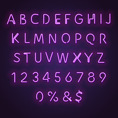 Alphabet neon sign. Glowing neon letters and numbers. Letters glowing in retro colors. Realistic bended neon tubes glowing in purple.
