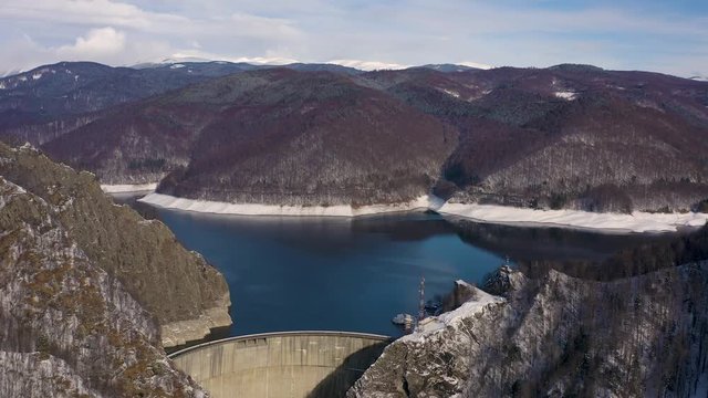  4K aerial footage with dam lake Vidraru in Romania during winter