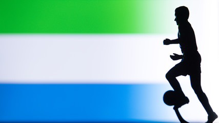 Fototapeta na wymiar Sierra Leone National Flag. Football, Soccer player Silhouette