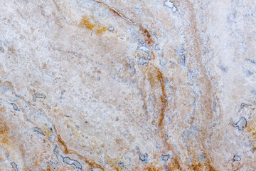 the texture of artificial marble is light natural beige with a beautiful pattern and dark inclusions.