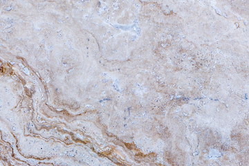 the texture of artificial marble is light natural beige with a beautiful pattern and dark inclusions.