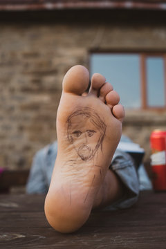 Sole of foot of an hiker during break, painted portrait