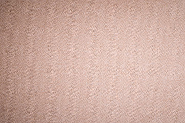Fototapeta premium Textured background surface of textile upholstery furniture close-up. burlap beige color fabric structure