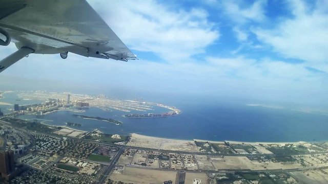 Aerial view 2 of Dubai from plane, Palm Jumeirah and Dubai Marina skyline - Video HD (series of 4 videos)
