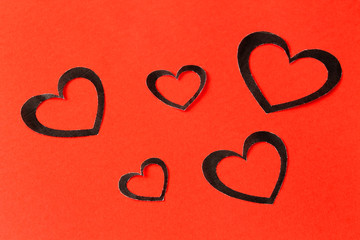 Paper hearts on a red background. Valentine's Day. Valentines day greeting card