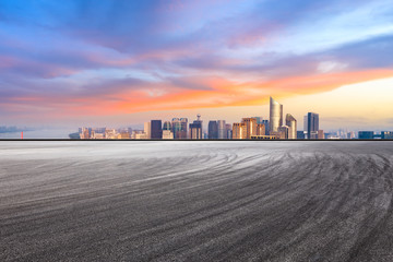 Obraz premium Asphalt square ground and city skyline in Hangzhou at sunrise,high angle view