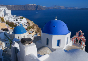 White architecture and famous little churches with blue domes