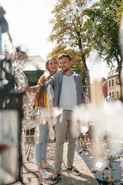 Belgium, Tongeren, happy young couple on an antique flea market