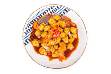 Korean pork in sweet and sour sauce on a white background