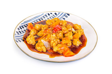 Korean pork in sweet and sour sauce on a white background