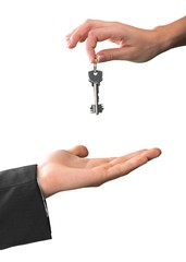 Businessperson Giving the Keys to Another Businessperson