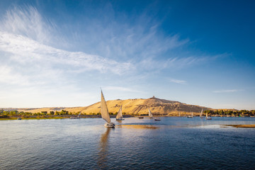 River nile with traditional boats at sunset. Live on the river Nile - obrazy, fototapety, plakaty