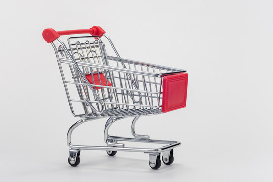 Empty grocery cart on white background
