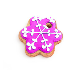 Homemade pink gingerbread Christmas cookie, isolated on white. Holiday decoration, winter time food.