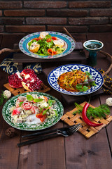 different dishes on a wooden background in Oriental style