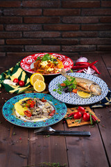 different dishes on a wooden background in Oriental style