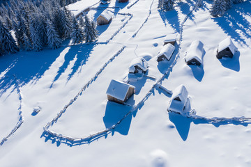 Snow covered remote village. Aerial view