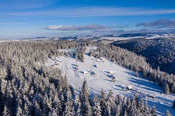Snow covered remote village. Aerial view