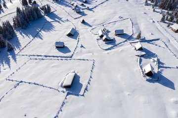 Snow covered remote village. Aerial view