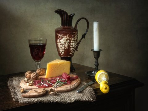 Still life with red wine and smoked meat