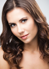 Obraz premium Portrait of beautiful woman, over grey