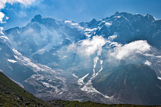 Panoramic view of the imposing east face of Monte Rosa against the light, above Macugnaga in Piedmont, Italy.