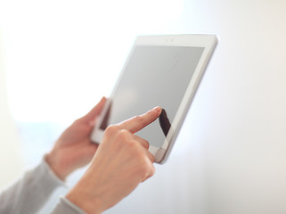 close up.woman's hand pressing on screen digital tablet .photo w