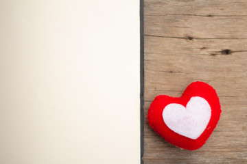 Blank paper with heart shape on wood table background.,Love concept for valentine's day. vintage tone.