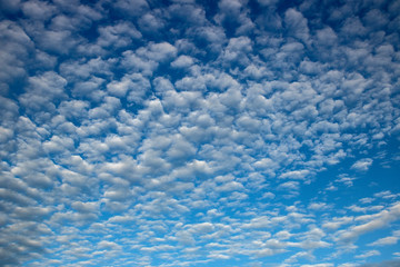 Blue sky background with a tiny clouds