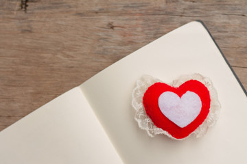 Heart shape on book on nature background.,Love concept for valentine's day. vintage tone.