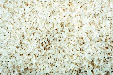 Organic White Long Rice Background Close-up Texture.