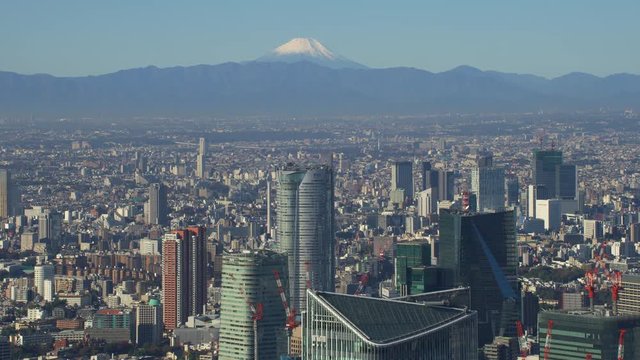 Tokyo, Japan circa-2018.  Flying over Tokyo with view of Mt. Fuji.  Shot from helicopter with RED camera.
